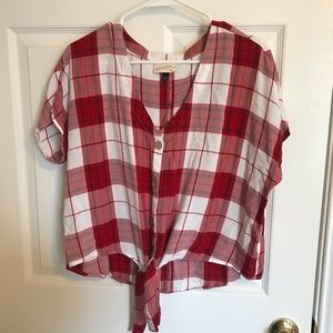Short sleeve plaid button down with tie detail.